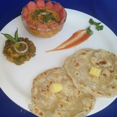 Navratna korma,potato beans veg with layered paratha A picture of Navratna korma,potato beans veg with layered paratha.