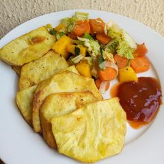 Fried sweet potatoes with steamed veggies A picture of Fried sweet potatoes with steamed veggies.
