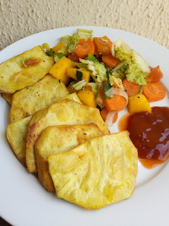 A picture of Fried sweet potatoes with steamed veggies.