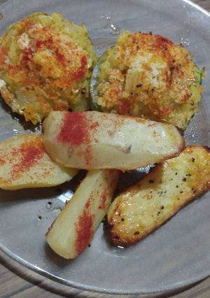 Una foto de Zapallitos al horno relleno con arroz 😋
