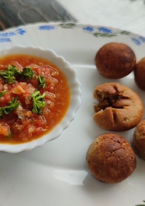 A picture of Bati in Appam Maker with Tomato Chokha.