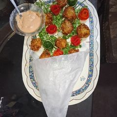 A picture of Lacha Dar potatoes and filled chicken pokora.