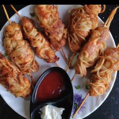 A picture of Noodles wrapped chicken.