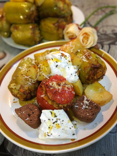 A picture of 🍅 Stuffed Tomatoes and 🌶️ Peppers with Ground Beef.