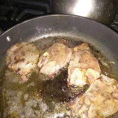 A picture of Bacon topped steak.