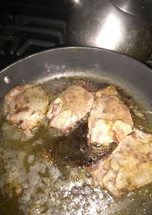 A picture of Bacon topped steak.