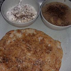 A picture of Ekadashi chilla with rasa aloo.