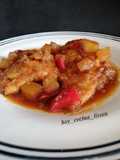 Pollo a la naranja con piña y pimientos