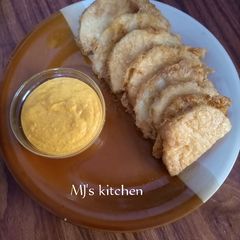 Fried yam coated with egg and spicy fry sauce A picture of Fried yam coated with egg and spicy fry sauce.