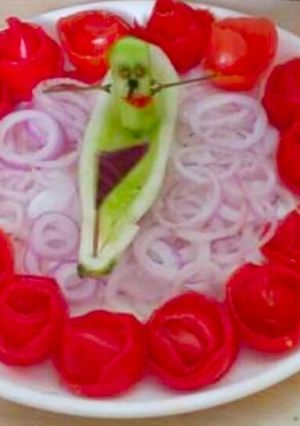 A picture of Cucumber and Tomato Flowers Salad.