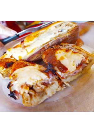 Una foto de Berenjenas rayadas rellenas