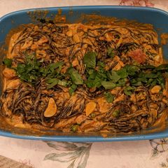 A picture of Squid ink pasta with calamari.
