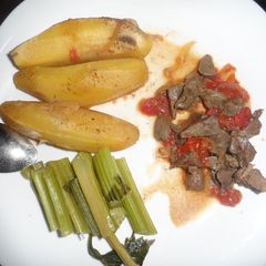 A picture of Matoke served with liver and Celery stalks.