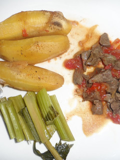 A picture of Matoke served with liver and Celery stalks.