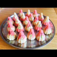 A picture of Rose coconut modak.