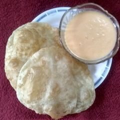 Aam rus with puri A picture of Aam rus with puri.
