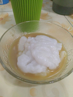 A picture of Bubur Sumsum (rice porridge with palm sugar sauce).