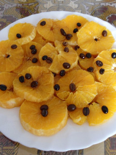 Una foto de Naranjas flambeadas