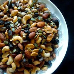 A picture of Crispy Crunchy Masala Mixed Nuts and Seeds with Raisins.