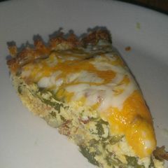 A picture of Spinach & Bacon Quiche with hash brown crust.