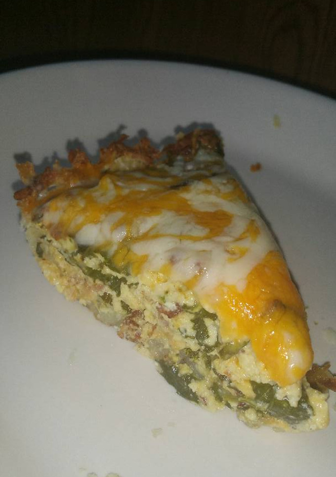 A picture of Spinach & Bacon Quiche with hash brown crust.