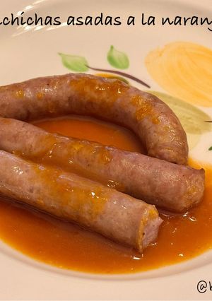Una foto de Salchichas asadas a la naranja