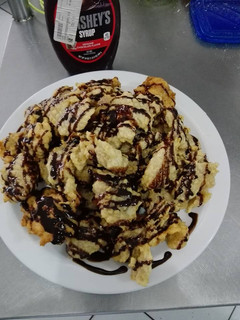 Una foto de Frituras con coco bañadas con chocolate