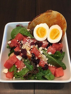 A picture of Spinach and Water Melon Salad with Tortilla Grilled Cheese.