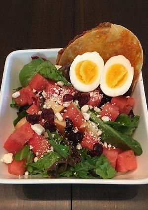 A picture of Spinach and Water Melon Salad  with  Tortilla Grilled Cheese.