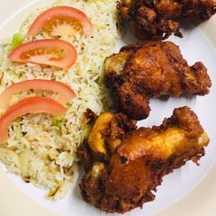 Garlic fried rice with crispy chicken wings A picture of Garlic fried rice with crispy chicken wings.