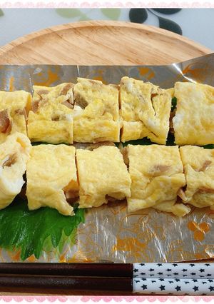 A picture of Egg Tamagoyaki with Menma and Shiso.