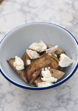 A picture of BBQ pear with goats cheese.