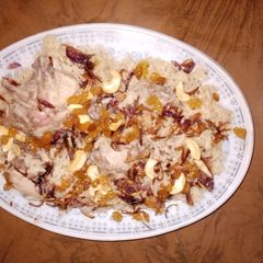 A picture of Chicken Delhi pulao & tomato - onion ratia 🍅🧅🧄.