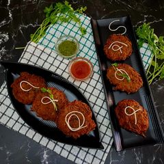 A picture of Noodles Vegetable Fritters.
