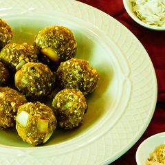A picture of Laddu with poha, peanuts, and coconut.