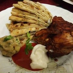 A picture of Potato Paratha(আলুর পরোটা) with Spicy Chicken.