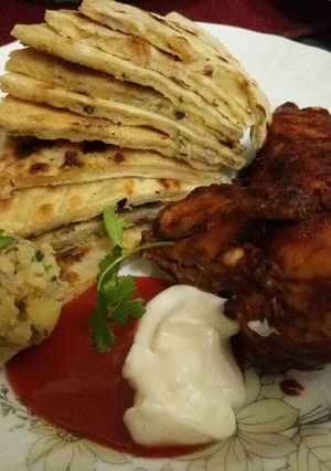 A picture of Potato Paratha(আলুর পরোটা) with Spicy Chicken.