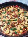Shakshuka with Eggs and Cheese