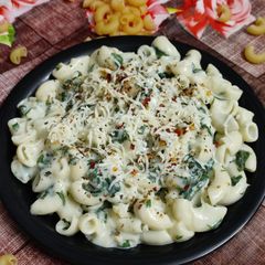 White sauce pasta with garlic & spinach twist A picture of White sauce pasta with garlic & spinach twist.
