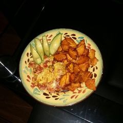 A picture of Fried sweet potato and scrambled eggs.