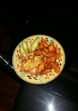 A picture of Fried sweet potato and scrambled eggs.