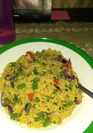 A picture of Noodles with greens.