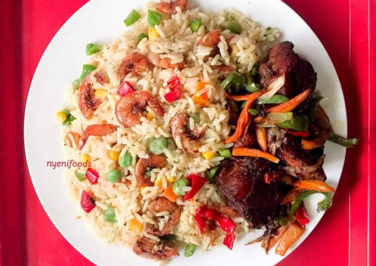 Coconut rice garnished with shrimps and vegetables