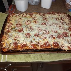 A picture of Homemade pizza. Q man chews style.