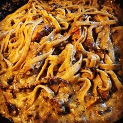 A picture of Chicken and Mushrooms Alfredo Pesto Pasta.