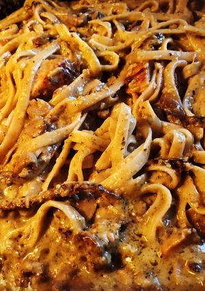 A picture of Chicken and Mushrooms Alfredo Pesto Pasta.
