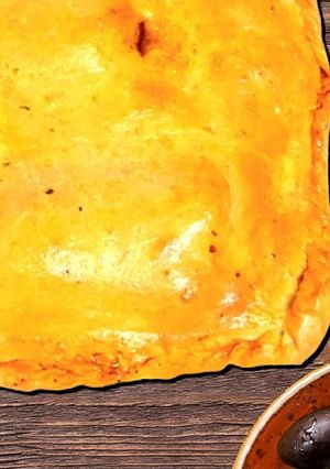 A picture of Closed white fish pie in Pesto sauce.