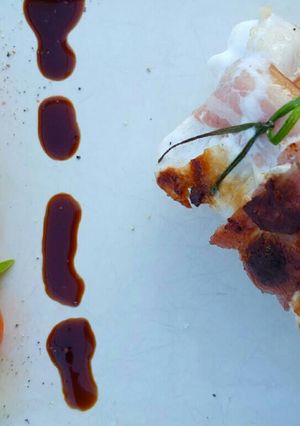 A picture of 'Surf and Turf' Paupiette: Bacon-Wrapped Brown Trout.