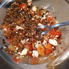 A picture of Tj's bruschetta with feta cheese and lentil.