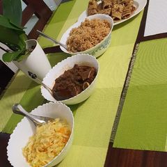 Pilau, beef stew, carroted cabbage and chapati A picture of Pilau, beef stew, carroted cabbage and chapati.